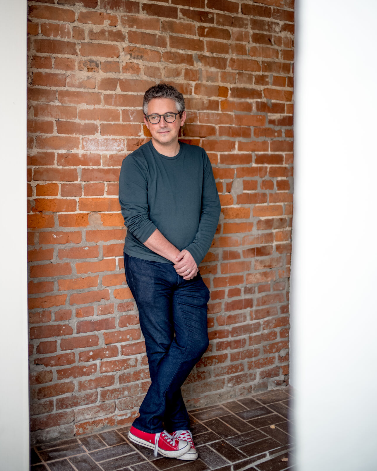 Alex George poses for a portrait outside Skylark Bookshop